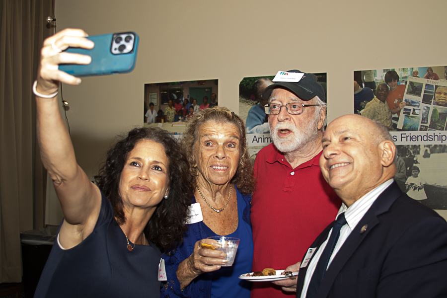 four people taking a selfie