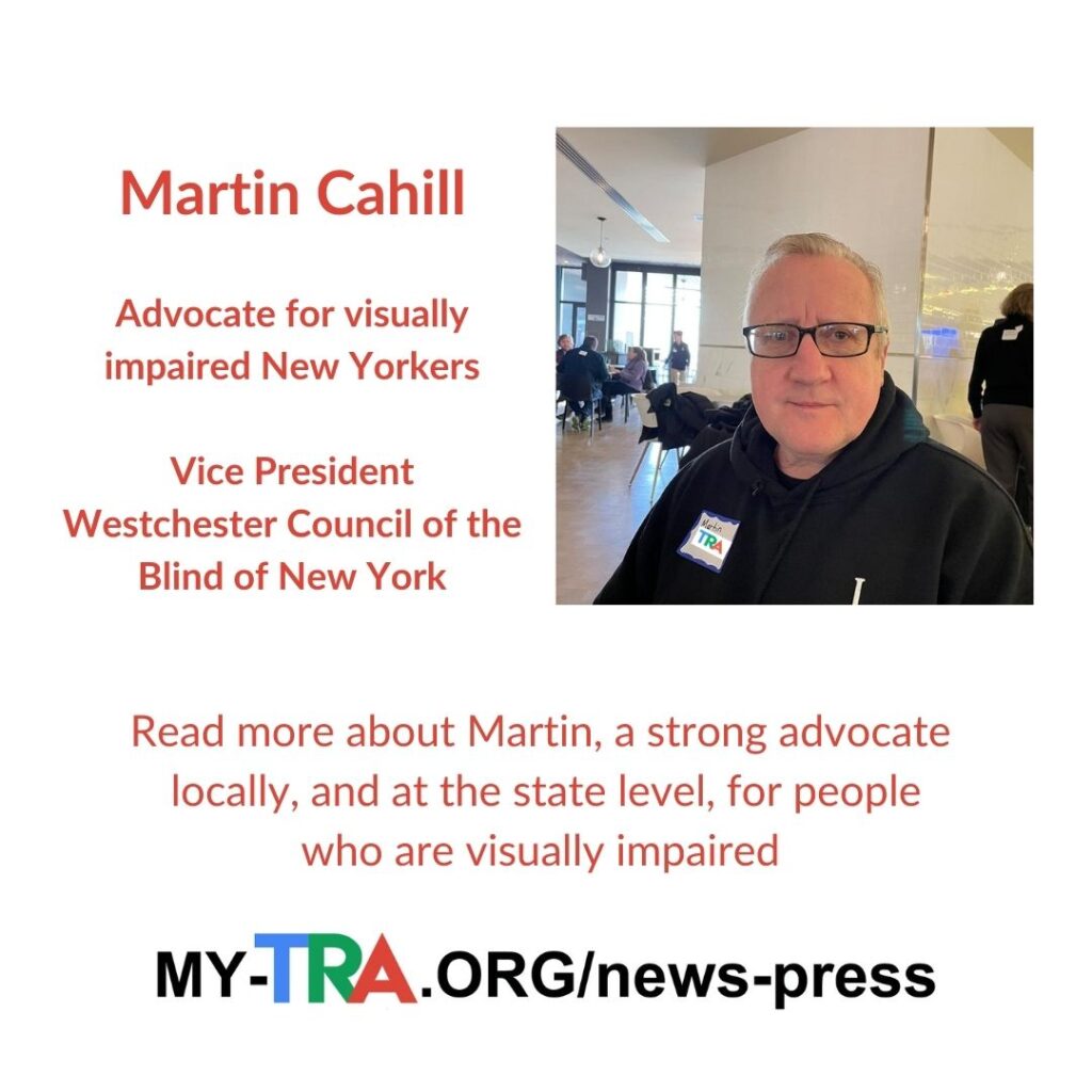 Martin Cahill, Advocate for Visually Impaired and Blind New Yorkers looking directly at camera wearing dark color sweater and dark glasses
